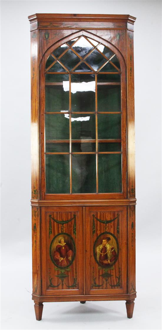 An Edwardian Sheraton revival painted satinwood corner cabinet, W.2ft 4in. H.6ft 6in.